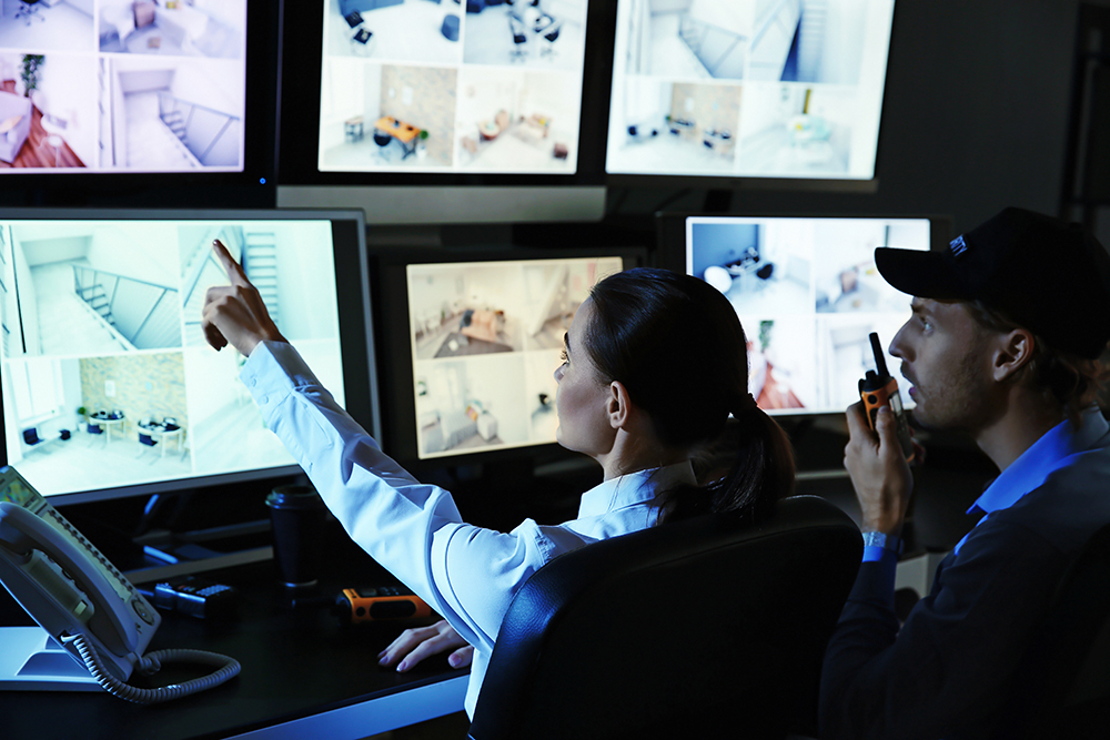 Security guards monitoring alarm and security systems in our control room in Perth.