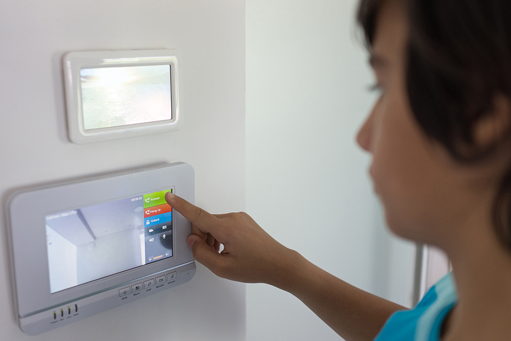 Woman monitoring a video intercom