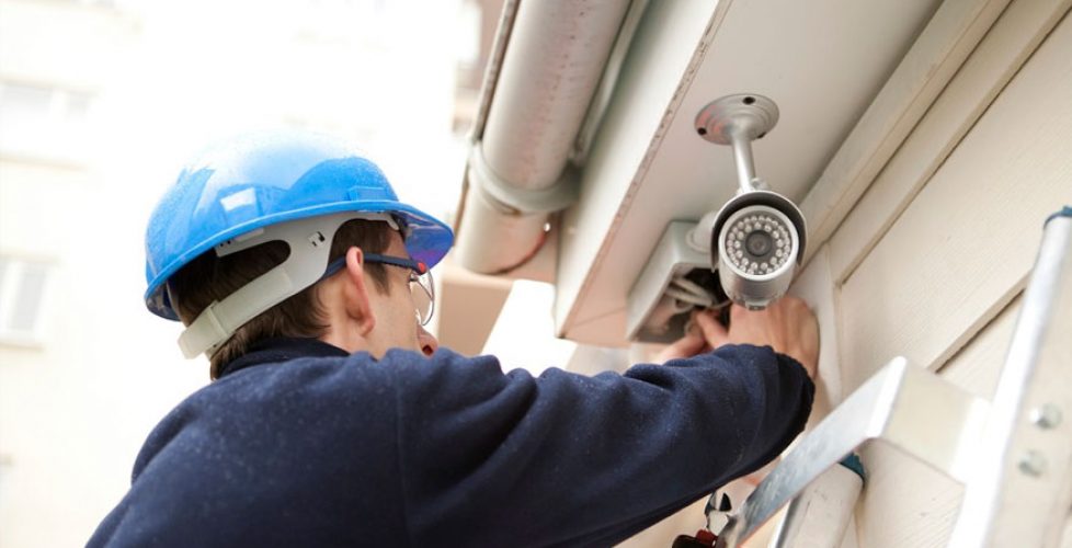 Security camera specialist installing CCTV.